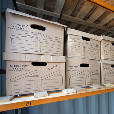 Carboard storage boxes on shelf