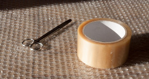 Sticky tape, scissors and bubble wrap