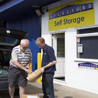 Customer showing package to Aylesford Self Storage staff
